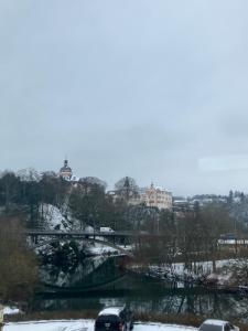 a car driving under a bridge in the snow at Hotel Lahnblick in Weilburg