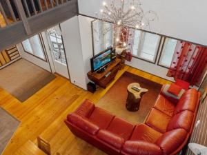 an overhead view of a living room with a couch and a television at Holiday Home Kelkka 2 by Interhome in Salla +13 photos