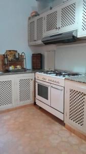 a kitchen with a white stove top oven at Dar Chamss in Taroudant +61 photos