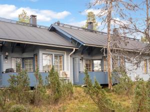 a blue house with a gray roof at Holiday Home Siulapalkinen a 4 by Interhome in Saariselka