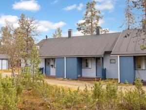 a blue house with a gray roof at Holiday Home Siulapalkinen a 4 by Interhome in Saariselka +14 photos