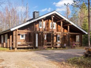 a large log cabin in the woods at Holiday Home Kranni 2 by Interhome in Syöte