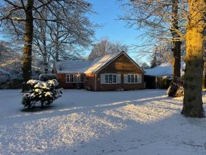 a house with snow on the ground in front of it at Birch View, Woodhall Spa in Woodhall Spa