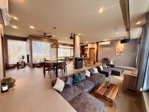 a living room with a couch and a table at Zenith Retreat in Xiaoliuqiu