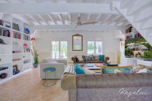 a living room with a couch and a table at Villa Kazalou in Saint Martin