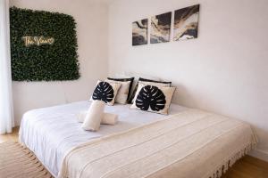 a bedroom with a bed with pillows on it at The View in Sunderland
