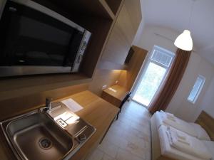 Letto o letti in una camera di Hotel Aton