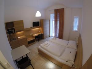 Postel nebo postele na pokoji v ubytování Hotel Aton + 37 fotografií
