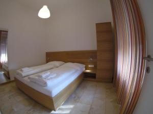 Letto o letti in una camera di Hotel Aton