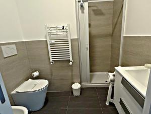 a bathroom with a shower and a toilet and a sink at Garba Stop in Rome