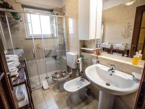 a bathroom with a sink and a toilet and a shower at Frank & Giuly House in Rivoli +13 photos