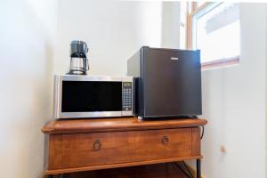 a microwave sitting on top of a wooden table at Bear Creek Lodge 209C in Telluride