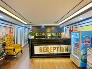 a living room with a fireplace and a yellow chair at Diamond Hotel CoLinh in Long Biên