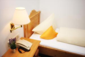 Postel nebo postele na pokoji v ubytování Hotel Trasen