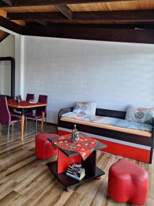 a room with a bed and a table and chairs at The Mountain House Doris in Kruševo +8 photos