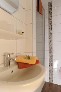 a bathroom with a bath tub with a towel on it at Gasthof Robens in Dormagen