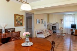 a living room with a table and a couch at Villa Marchetti in Cupra Marittima
