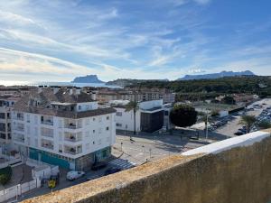 a view of a city with buildings and a street at Ap. con piscina, Moraira centro. in Moraira