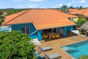 an aerial view of a house with an orange roof at Villa Monte Azul in Willemstad +32 photos