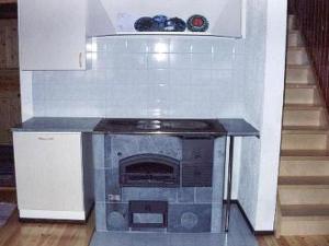 a kitchen with a stove top oven in a room at Holiday Home 6332 by Interhome in Rantakylä