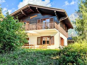 an external view of a house with a balcony at Chalet Le Katanga by Interhome in Ovronnaz
