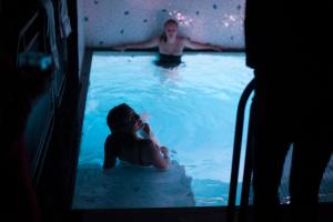 a man and a woman in a swimming pool at Hotel Les Bains Paris in Paris