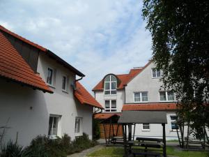 a group of buildings with red roofs at Hotel Schützenhaus in Bad Düben