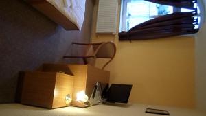 a room with a desk with a box and a window at Hotel Schützenhaus in Bad Düben