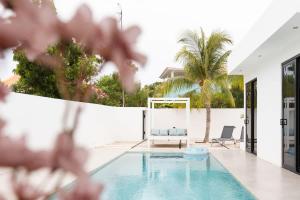 a swimming pool in the middle of a house at Casa Familia in Grote Berg