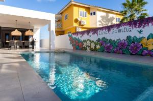 a swimming pool in front of a building at Casa Familia in Grote Berg +33 photos