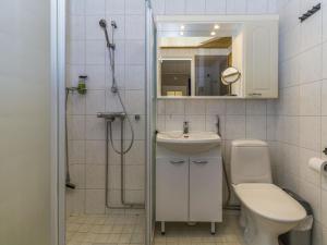 a bathroom with a toilet and a sink and a shower at Holiday Home Levin mini by Interhome in Sirkka
