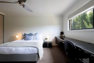 a bedroom with a large bed and a window at Modern Newnham Retreat in Newnham