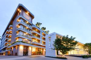 a rendering of a hotel with a building at Hisea Huahin Hotel in Hua Hin