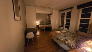 a hotel room with a bed and a mirror at 4 Lions Guest House in Gdańsk