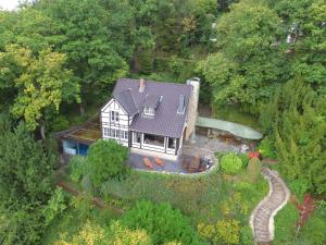 an aerial view of a house in the woods at Ferienhaus am Rursee - Haus Eiche in Simmerath