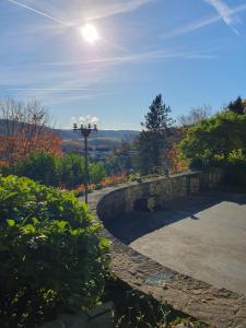 a street light sitting next to a stone wall at Ferienhaus am Rursee - Haus Eiche in Simmerath