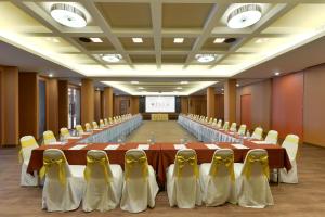 a large conference room with a long table and chairs at Hisea Huahin Hotel in Hua Hin