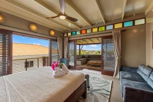 a bedroom with a bed and a couch at Bali Suites - Penthouse in Willemstad +36 photos