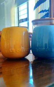 two bowls sitting on top of a wooden table at Caledonia Guest Room in Trichardt +18 photos