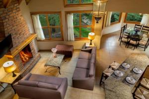 an aerial view of a living room with a fireplace at Bosque Escondido in Mazamitla