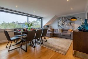 a dining room and living room with a table and chairs at 4 Bed in Carbis Bay oc-m30075 in Carbis Bay