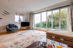 a living room with a bed and a large window at 4 Bed in Carbis Bay oc-m30075 in Carbis Bay
