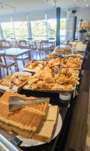 a buffet filled with lots of different types of bread at Aguasol Hotel Termal in Termas del Daymán