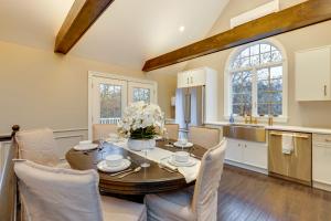 a kitchen and dining room with a table and chairs at Summer Beach Pass: Wooded Martha's Vineyard Escape in Vineyard Haven