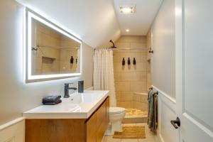 a bathroom with a sink and a toilet at Summer Beach Pass: Wooded Martha's Vineyard Escape in Vineyard Haven +25 photos