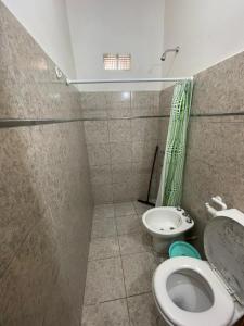 a bathroom with a toilet and a sink at Brian Cuello in San Rafael