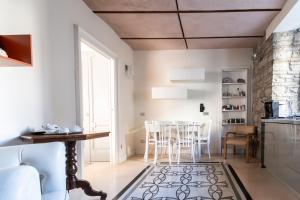 a living room with a couch and a table at La suite del convento in Potenza