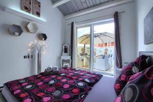 a bedroom with a bed and a large window at Charming villa Darte with private pool near Rovinj, extra pool heating available in Kanfanar