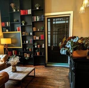 a living room with a door and a coffee table at Le Château de La Pomarède in La Pomarède +28 photos