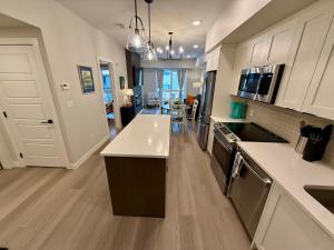 a kitchen with white cabinets and a white counter top at Sparrowhawk Mountain Resort in Dead Man's Flats